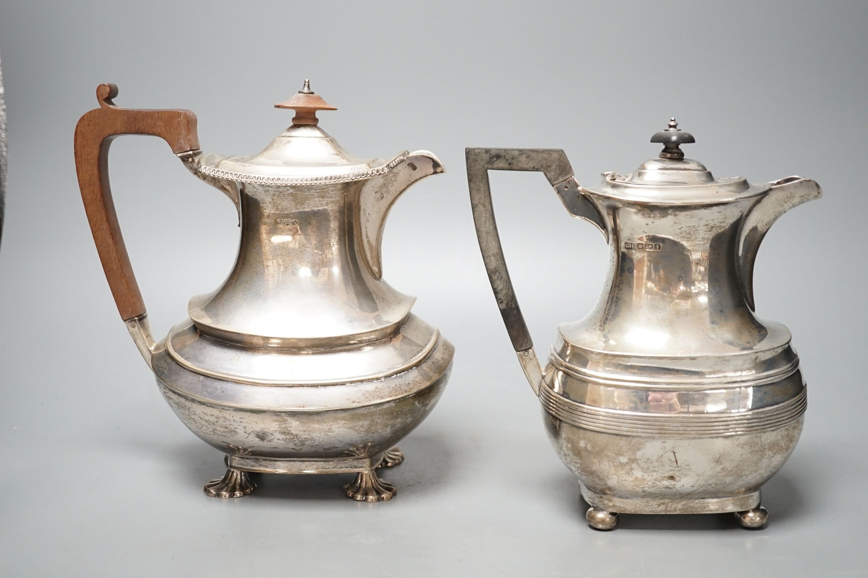 Two George V silver hot water pots, gross 39oz.